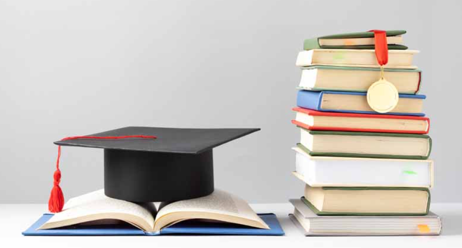 Stack of books with a graduation cap and medal, representing education, learning, and academic success.